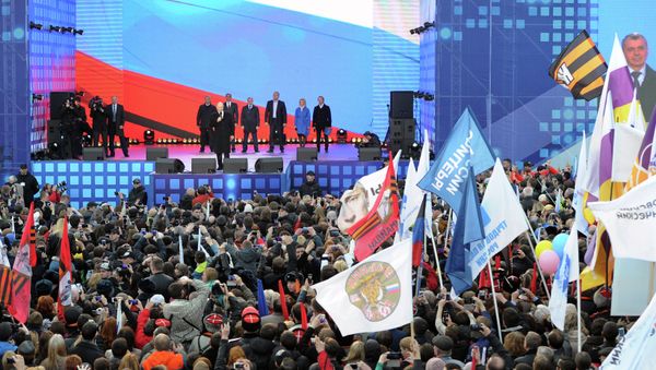 Russian President Vladimir Putin delivers a speech during a festive concert marking the first anniversary of the Crimean treaty signing in central Moscow Russian President Vladimir Putin delivers a speech during a festive concert marking the first anniversary of the Crimean treaty signing in central Moscow - Sputnik International