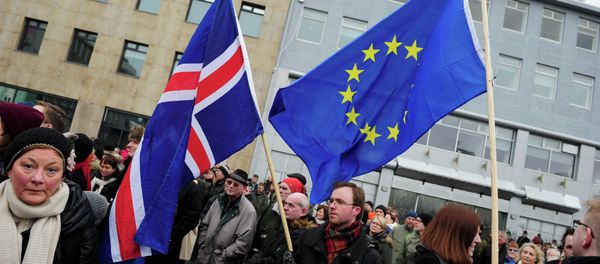 People rally during a protest against the Icelandic government's decision not to start negotiations with the European Union about joining the bloc, in Reykjavik People rally during a protest against the Icelandic government's decision not to start negotiations with the European Union about joining the bloc, in Reykjavik - Sputnik International