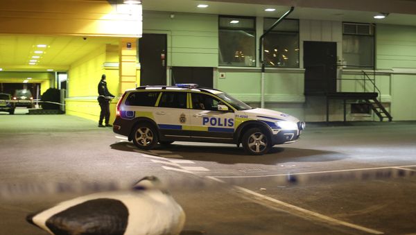 A police officer stands at the scene of a fatal shooting in Gothenburg A police officer stands at the scene of a fatal shooting in Gothenburg - Sputnik International