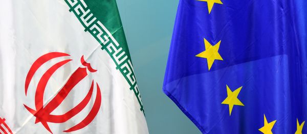 An Iranian (L) and a European flag are set on March 16, 2015 - Sputnik International