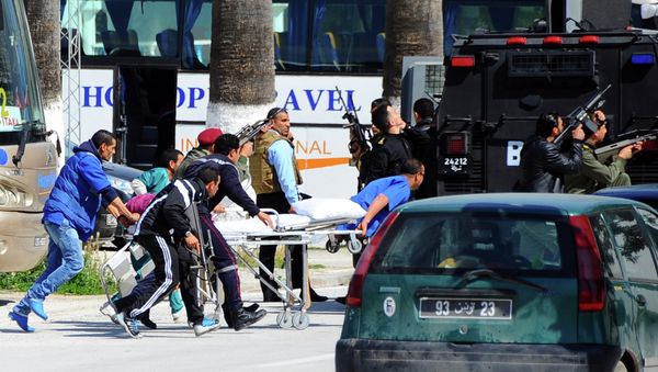 Escorted by security forces, rescue workers pull an empty stretcher outside the Bardo museum Wednesday, March 18, 2015 in Tunis Escorted by security forces, rescue workers pull an empty stretcher outside the Bardo museum Wednesday, March 18, 2015 in Tunis - Sputnik International