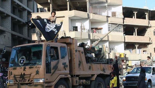 Fighters from the al-Qaida linked Islamic State of Iraq and the Levant (ISIL) during a parade in Raqqa, Syria Fighters from the al-Qaida linked Islamic State of Iraq and the Levant (ISIL) during a parade in Raqqa, Syria - Sputnik International