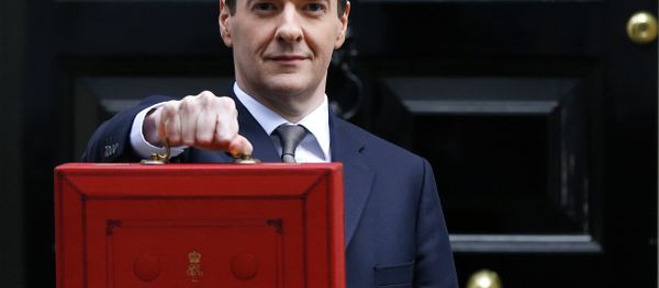 Britain's Chancellor George Osborne poses for the media with the traditional red dispatch box outside his official residence at 11 Downing Street in London Britain's Chancellor George Osborne poses for the media with the traditional red dispatch box outside his official residence at 11 Downing Street in London - Sputnik International