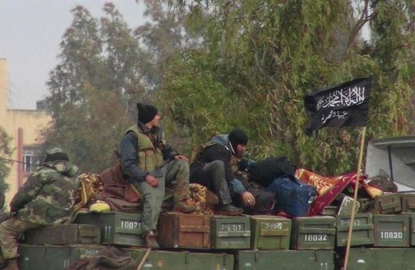 Rebels from al-Qaida affiliated Jabhat al-Nusra, as they sit on a truck full of ammunition, at Taftanaz air base, that was captured by the rebels, in Idlib province, northern Syria - Sputnik International