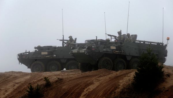 Soldiers of the U.S. Army's 2nd Cavalry Regiment, deployed in Latvia as part of NATO's Operation Atlantic Resolve, ride in armored vehicles named Stryker during a joint military exercise in Adazi Soldiers of the U.S. Army's 2nd Cavalry Regiment, deployed in Latvia as part of NATO's Operation Atlantic Resolve, ride in armored vehicles named Stryker during a joint military exercise in Adazi - Sputnik International