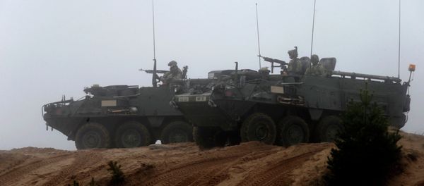 Soldiers of the U.S. Army's 2nd Cavalry Regiment, deployed in Latvia as part of NATO's Operation Atlantic Resolve, ride in armored vehicles named Stryker during a joint military exercise in Adazi Soldiers of the U.S. Army's 2nd Cavalry Regiment, deployed in Latvia as part of NATO's Operation Atlantic Resolve, ride in armored vehicles named Stryker during a joint military exercise in Adazi - Sputnik International