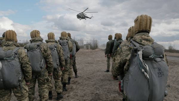 Ukrainian army soldiers perform a military exercise at a training ground outside Zhitomir, Ukraine Ukrainian army soldiers perform a military exercise at a training ground outside Zhitomir, Ukraine - Sputnik International
