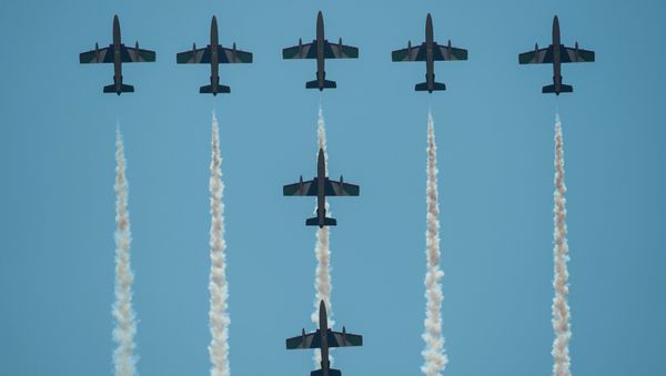 United Arab Emirates (UAE) Air Force aerobatic team Fursan planes perform during the Langkawi International Maritime and Aerospace Exhibition 2015 (LIMA’15) in Malaysia's resort island of Langkawi on March 18, 2015 United Arab Emirates (UAE) Air Force aerobatic team Fursan planes perform during the Langkawi International Maritime and Aerospace Exhibition 2015 (LIMA’15) in Malaysia's resort island of Langkawi on March 18, 2015 - Sputnik International
