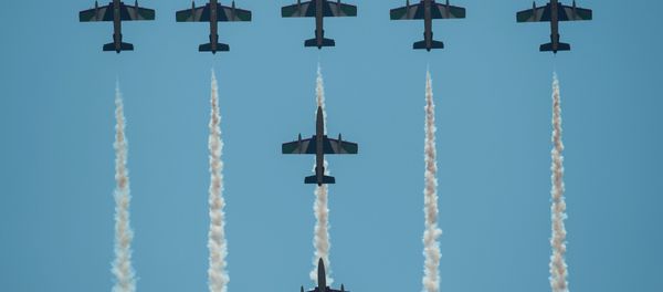 United Arab Emirates (UAE) Air Force aerobatic team Fursan planes perform during the Langkawi International Maritime and Aerospace Exhibition 2015 (LIMA’15) in Malaysia's resort island of Langkawi on March 18, 2015 - Sputnik International