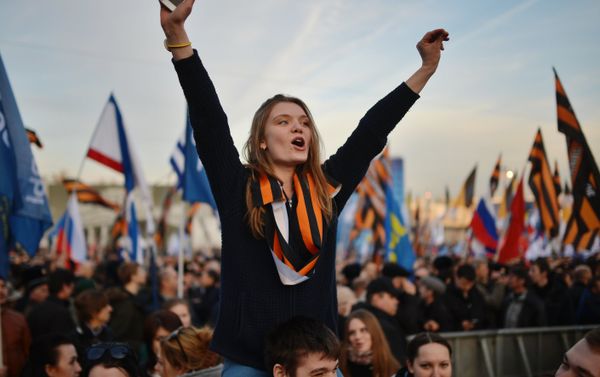 Rally and concert on Vasilyevsky Slope to mark anniversary of Crimea's reunification with Russia - Sputnik International