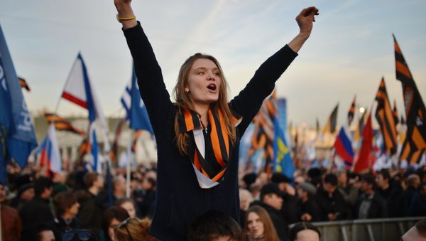 Rally and concert on Vasilyevsky Slope to mark anniversary of Crimea's reunification with Russia - Sputnik International