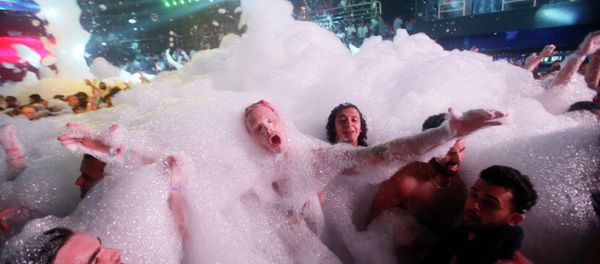 Partygoers dance in foam at The City nightclub in the Caribbean resort city of Cancun, Mexico, early Monday, March 16, 2015 Partygoers dance in foam at The City nightclub in the Caribbean resort city of Cancun, Mexico, early Monday, March 16, 2015 - Sputnik International