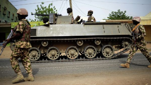 Nigerian troops patrol in the north-eastern Nigerian city of Mubi, some 20 kms (14 miles) west of the Cameroon border Nigerian troops patrol in the north-eastern Nigerian city of Mubi, some 20 kms (14 miles) west of the Cameroon border - Sputnik International