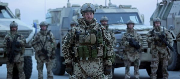German soldiers stand guard during the NATO Secretary-General Jens Stoltenberg's first visit - Sputnik International