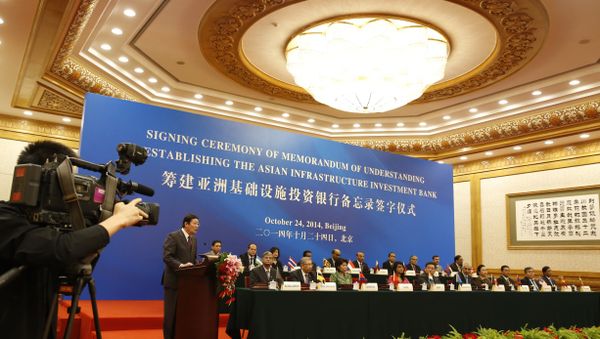 Chinese Finance Minister Lou Jiwei (2nd L) gives a speech for guests at the signing ceremony of the Asian Infrastructure Investment Bank at the Great Hall of the People in Beijing Chinese Finance Minister Lou Jiwei (2nd L) gives a speech for guests at the signing ceremony of the Asian Infrastructure Investment Bank at the Great Hall of the People in Beijing - Sputnik International