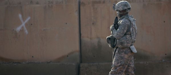 A US soldier walks at the Taji base complex which hosts Iraqi and US troops and is located thirty kilometres north of the capital Baghdad A US soldier walks at the Taji base complex which hosts Iraqi and US troops and is located thirty kilometres north of the capital Baghdad - Sputnik International
