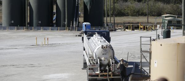 In this Wednesday, Nov. 19, 2014 photo, a fracking wastewater storage facility sits just outside the city limits of Reno, Texas In this Wednesday, Nov. 19, 2014 photo, a fracking wastewater storage facility sits just outside the city limits of Reno, Texas - Sputnik International
