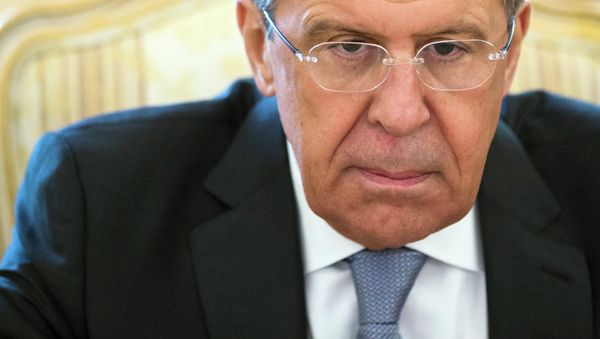 Russian Foreign Minister Sergey Lavrov listens during meeting with his counterpart from Gabon Emmanuel Issoze-Ngondet in Moscow Russian Foreign Minister Sergey Lavrov listens during meeting with his counterpart from Gabon Emmanuel Issoze-Ngondet in Moscow - Sputnik International