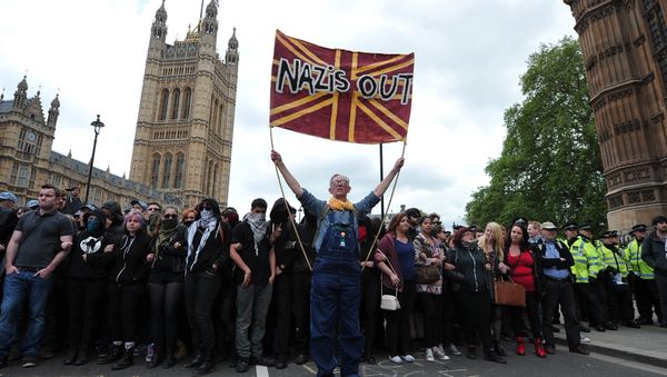 Unite Against Fascism (UAF) supporters protest during a demonstration against the British National Party (BNP) in central London. File photo Unite Against Fascism (UAF) supporters protest during a demonstration against the British National Party (BNP) in central London. File photo - Sputnik International