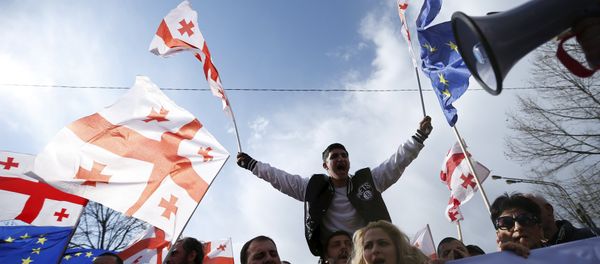 Opposition supporters march on the street during a rally organised by the United National Movement, calling for the resignation of the government in Tbilisi Opposition supporters march on the street during a rally organised by the United National Movement, calling for the resignation of the government in Tbilisi - Sputnik International