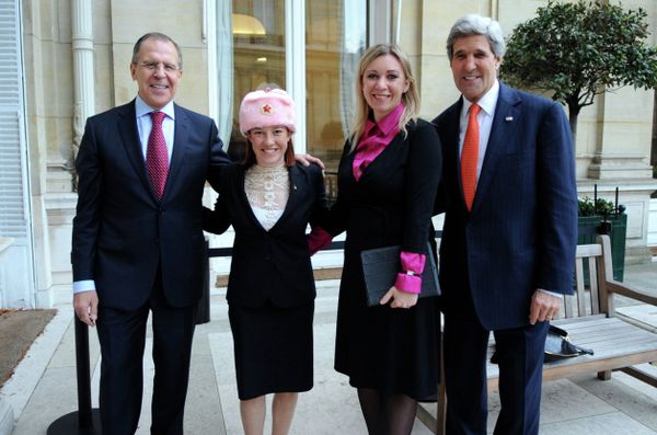 U.S. Department of State Spokesperson Jennifer Psaki -- sporting a shapka, or fur hat with ear flaps, given to her by Russian counterpart Maria Zakharova -- stands with Zakharova between U.S. Secretary of State John Kerry and Russian Foreign Minister Sergey Lavrov in Paris, France, on January 13, 2014 U.S. Department of State Spokesperson Jennifer Psaki -- sporting a shapka, or fur hat with ear flaps, given to her by Russian counterpart Maria Zakharova -- stands with Zakharova between U.S. Secretary of State John Kerry and Russian Foreign Minister Sergey Lavrov in Paris, France, on January 13, 2014 - Sputnik International