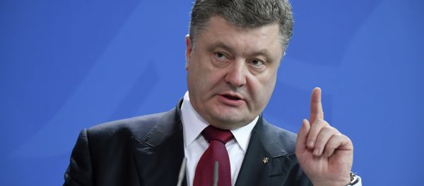 Ukrainian President Petro Poroshenko gestures as he gives a joint press conference with the German Chancellor (not in picture) on March 16, 2015 at the Chancellery in Berlin Ukrainian President Petro Poroshenko gestures as he gives a joint press conference with the German Chancellor (not in picture) on March 16, 2015 at the Chancellery in Berlin - Sputnik International