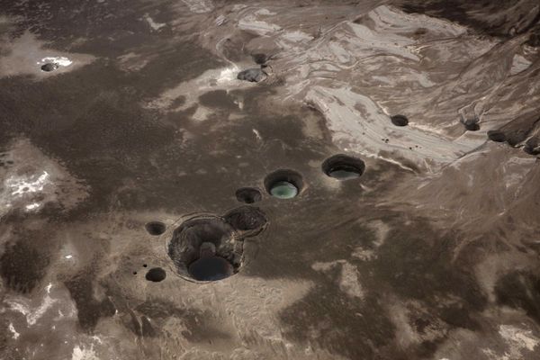 An aerial view photo shows sinkholes created by the drying of the Dead Sea, near Kibbutz Ein Gedi An aerial view photo shows sinkholes created by the drying of the Dead Sea, near Kibbutz Ein Gedi - Sputnik International