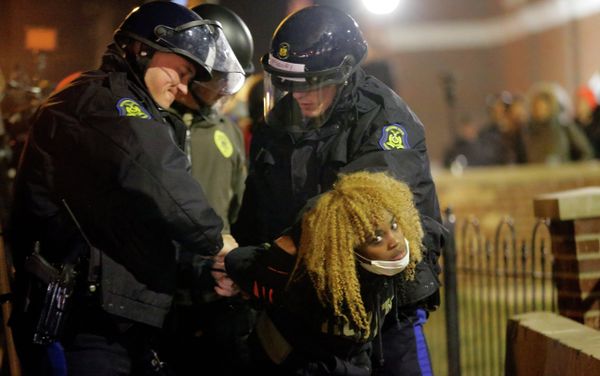Police officers take a protester into custody Tuesday, Nov. 25, 2014, in Ferguson, Mo. Police officers take a protester into custody Tuesday, Nov. 25, 2014, in Ferguson, Mo. - Sputnik International