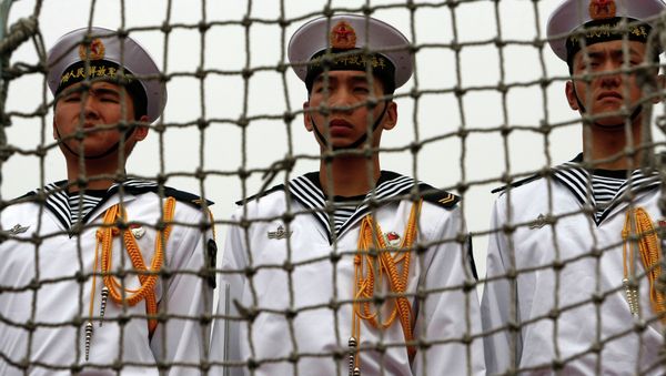 Chinese Navy seamen stand at attention on the deck of the Chinese missile frigate Ma'anshan, the flagship of the Chinese People's Liberation Army Navy Task Force 525 - Sputnik International