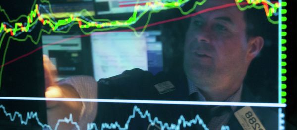 Specialist Michael McDonnell is reflected in a screen at his post on the floor of the New York Stock Exchange, Friday, March 20, 2015. - Sputnik International