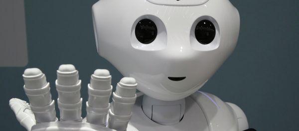 In this June 6, 2014 file photo, humanoid robot Pepper is on display at SoftBank mobile shop in Tokyo. Japanese mobile carrier Softbank said Tuesday, Feb. 10, 2015 it will incorporate artificial intelligence technology from IBM into its empathetic robot Pepper that goes on sale in Japan this month. In this June 6, 2014 file photo, humanoid robot Pepper is on display at SoftBank mobile shop in Tokyo. Japanese mobile carrier Softbank said Tuesday, Feb. 10, 2015 it will incorporate artificial intelligence technology from IBM into its empathetic robot Pepper that goes on sale in Japan this month. - Sputnik International