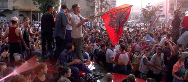 About 1,000 young Kosovar Albanians celebrate the UCK [Kosovo Liberation Army] victory over the Serbs with NATO's help in the centre of Pristina 02 July 1999 - Sputnik International