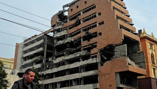 A man walks past the building of former federal military headquarters in Belgrade on March 24, 2010, destroyed during the 1999 NATO air campaign against Yugoslavia. A man walks past the building of former federal military headquarters in Belgrade on March 24, 2010, destroyed during the 1999 NATO air campaign against Yugoslavia. - Sputnik International