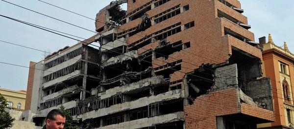 A man walks past the building of former federal military headquarters in Belgrade on March 24, 2010, destroyed during the 1999 NATO air campaign against Yugoslavia. A man walks past the building of former federal military headquarters in Belgrade on March 24, 2010, destroyed during the 1999 NATO air campaign against Yugoslavia. - Sputnik International