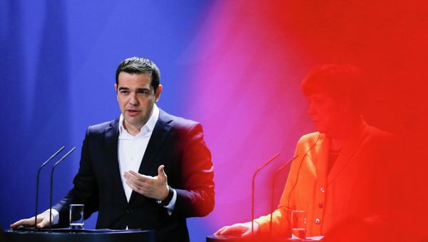 In this photo taken with a red television camera control light in the foreground, German Chancellor Angela Merkel, right, and the Prime Minister of Greece Alexis Tsipras In this photo taken with a red television camera control light in the foreground, German Chancellor Angela Merkel, right, and the Prime Minister of Greece Alexis Tsipras - Sputnik International