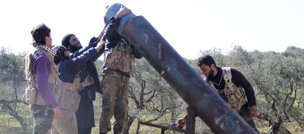Rebel fighters from Suqour al-Sham Brigade prepare to launch a locally made shell towards forces loyal to Syria's president Bashar Al-Assad who are stationed in checkpoints surrounding the city of Idlib Rebel fighters from Suqour al-Sham Brigade prepare to launch a locally made shell towards forces loyal to Syria's president Bashar Al-Assad who are stationed in checkpoints surrounding the city of Idlib - Sputnik International
