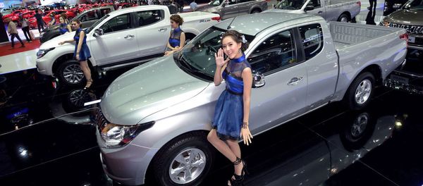 Models pose next to cars displayed at the 36th Bangkok International Motor Show on March 24, 2015 Models pose next to cars displayed at the 36th Bangkok International Motor Show on March 24, 2015 - Sputnik International