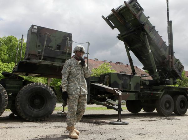 US soldier stands next to a Patriot surface-to-air missile battery at an army base in Morag, Poland. US soldier stands next to a Patriot surface-to-air missile battery at an army base in Morag, Poland. - Sputnik International