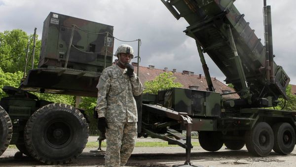 A US soldier stands next to a Patriot surface-to-air missile battery at an army base in Morag, Poland. File photo A US soldier stands next to a Patriot surface-to-air missile battery at an army base in Morag, Poland. File photo - Sputnik International