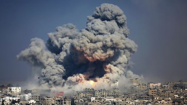 In this July 29, 2014 photo, smoke and fire from an Israeli strike rise over Gaza City. A fierce debate is raging within Israel's military over the extent to which soldiers should be held legally accountable for their actions during last year's Gaza war, with commanders increasingly at odds with military lawyers. In this July 29, 2014 photo, smoke and fire from an Israeli strike rise over Gaza City. A fierce debate is raging within Israel's military over the extent to which soldiers should be held legally accountable for their actions during last year's Gaza war, with commanders increasingly at odds with military lawyers. - Sputnik International