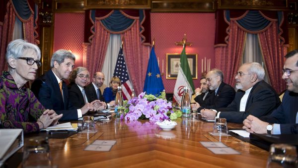 U.S. Secretary of State John Kerry waits with other officials for the start of a meeting at the Beau Rivage Palace Hotel in Lausanne U.S. Secretary of State John Kerry waits with other officials for the start of a meeting at the Beau Rivage Palace Hotel in Lausanne - Sputnik International