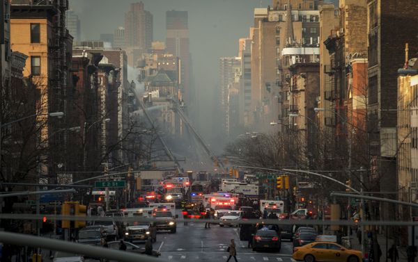 New York City Fire Department firefighters and emergency personnel respond at the site of a residential apartment building which had collapsed and was engulfed in flames in New York City's East Village neighborhood New York City Fire Department firefighters and emergency personnel respond at the site of a residential apartment building which had collapsed and was engulfed in flames in New York City's East Village neighborhood - Sputnik International