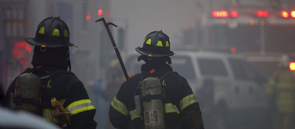 New York City Fire Department firefighters walk towards the site of a residential apartment building collapse and fire in New York City's East Village neighborhood New York City Fire Department firefighters walk towards the site of a residential apartment building collapse and fire in New York City's East Village neighborhood - Sputnik International
