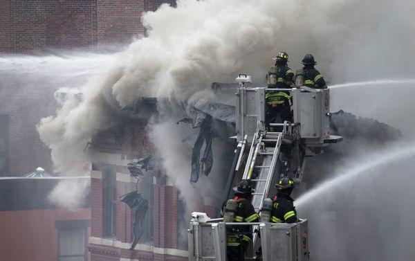 Firefighters spray water on a collapsed building in New York's East Village Firefighters spray water on a collapsed building in New York's East Village - Sputnik International