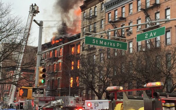 New York City firefighters work the scene of a large fire and a partial building collapse in the East Village neighborhood of New York New York City firefighters work the scene of a large fire and a partial building collapse in the East Village neighborhood of New York - Sputnik International