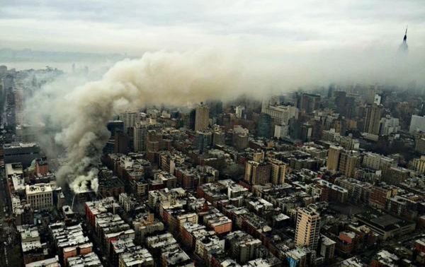 Smoke rises from the scene of a large fire and a partial building collapse in the East Village neighborhood of New York Smoke rises from the scene of a large fire and a partial building collapse in the East Village neighborhood of New York - Sputnik International