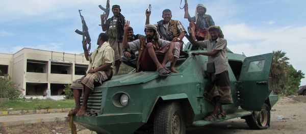 Militiamen loyal to President Abed Rabbo Mansour Hadi ride on an army vehicle on a street in Aden, Yemen - Sputnik International