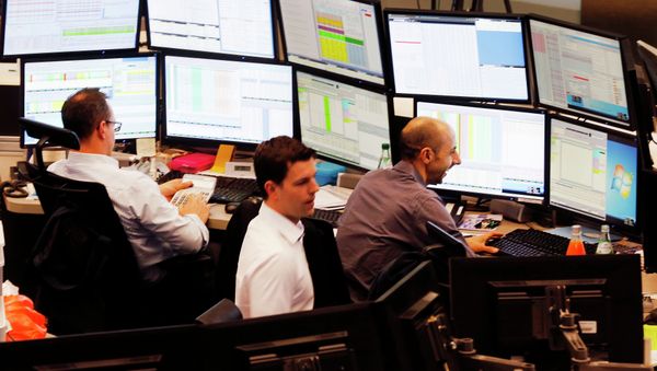 Traders watch their screens when the German stock index DAX reached its highest level in history with more than 12 000 points in Frankfurt, Germany, Monday, March 16, 2015 Traders watch their screens when the German stock index DAX reached its highest level in history with more than 12 000 points in Frankfurt, Germany, Monday, March 16, 2015 - Sputnik International