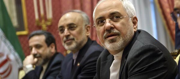Iranian Foreign Mohammad Minister Javad Zarif , right, waits for the start of a meeting with a US delegation at a hotel in Lausanne Switzerland Iranian Foreign Mohammad Minister Javad Zarif , right, waits for the start of a meeting with a US delegation at a hotel in Lausanne Switzerland - Sputnik International