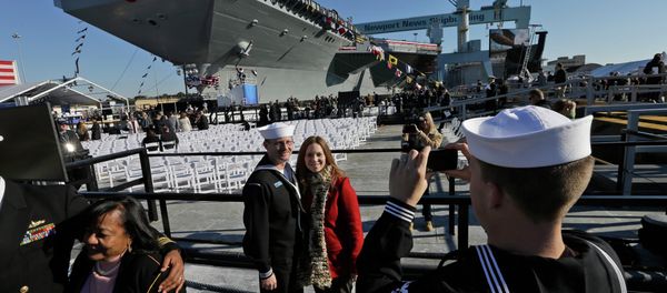 People pose for photos in front of Navy aircraft carrier USS Gerald R. Ford during the christening of the ship in November 2013. People pose for photos in front of Navy aircraft carrier USS Gerald R. Ford during the christening of the ship in November 2013. - Sputnik International